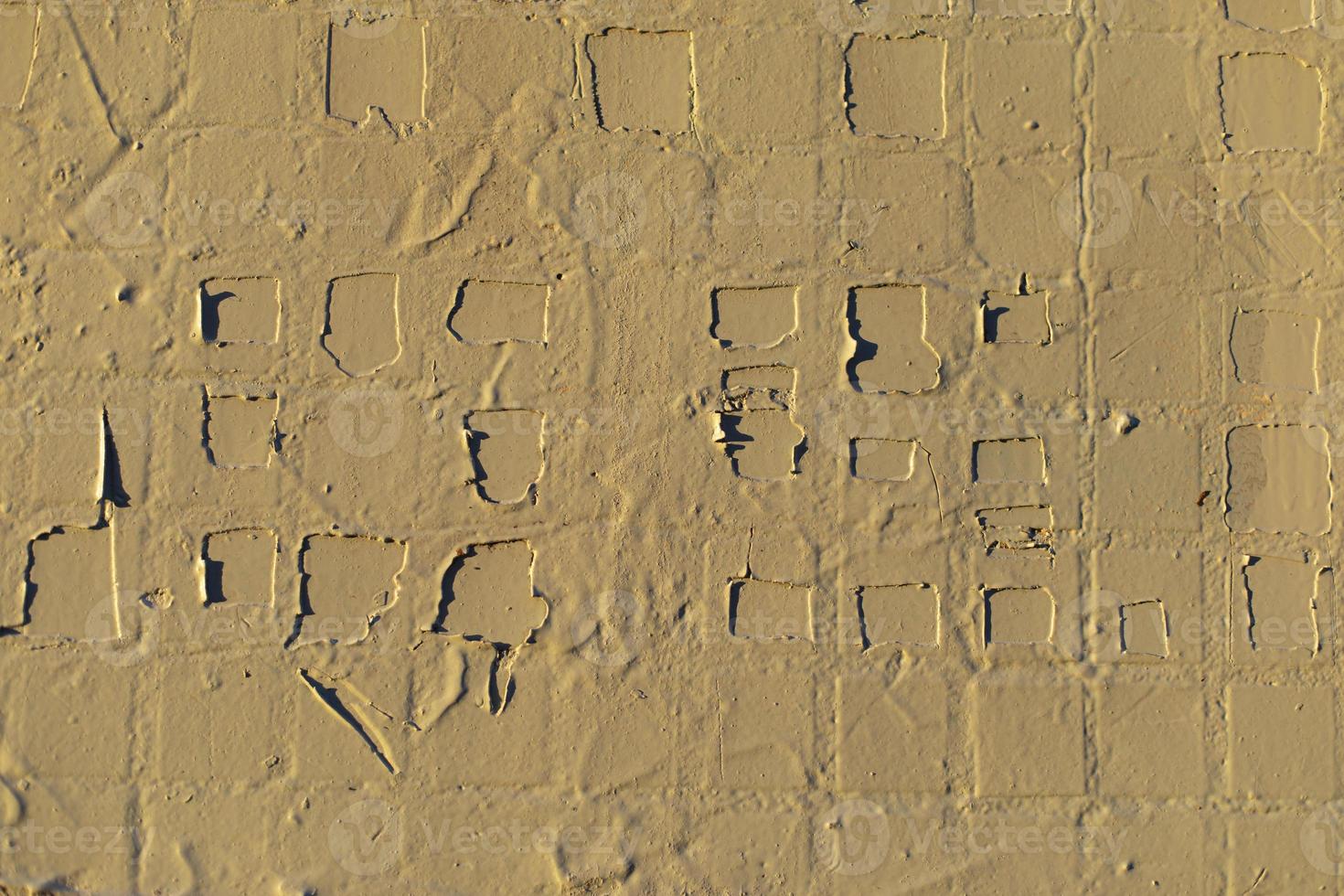 Texture of wall is in sunlight. Paint-smeared tiles. photo