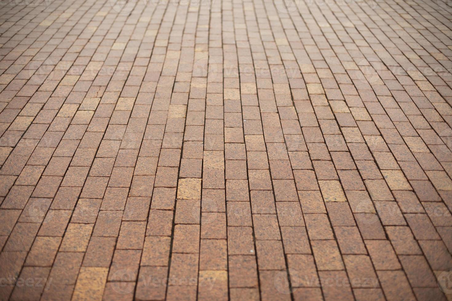 Stonework made of red cobblestones. Details of road. photo