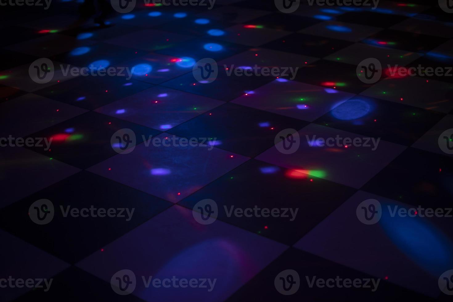 Color music at disco. Dance floor in club. Interior of room with illumination. photo