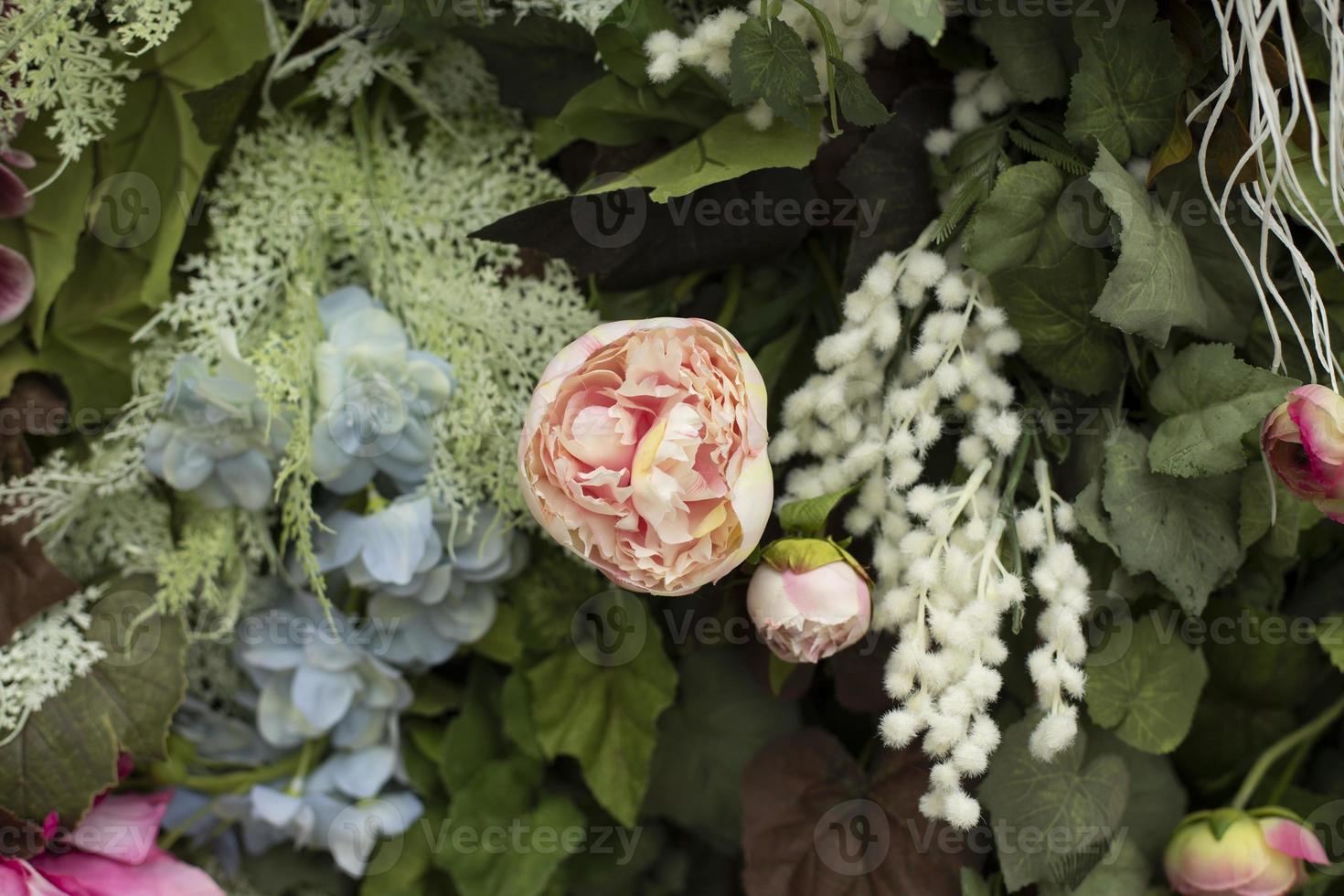 Texture flowers. Background of artificial flowers. Wall of inflorescences in detail. photo