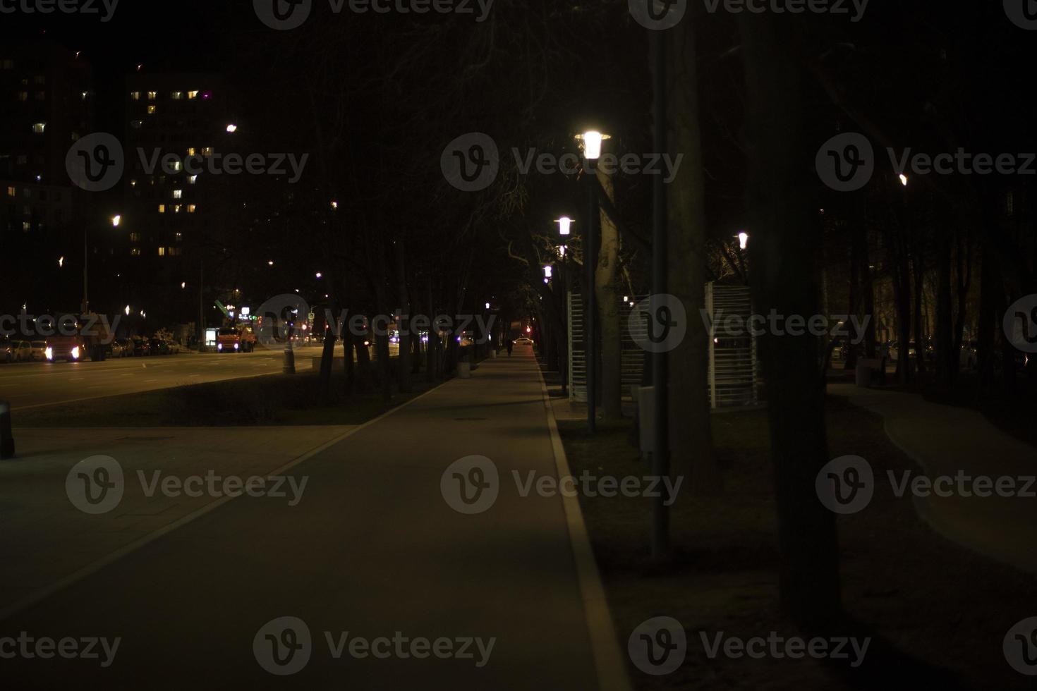 City at night. Street is in dark. photo