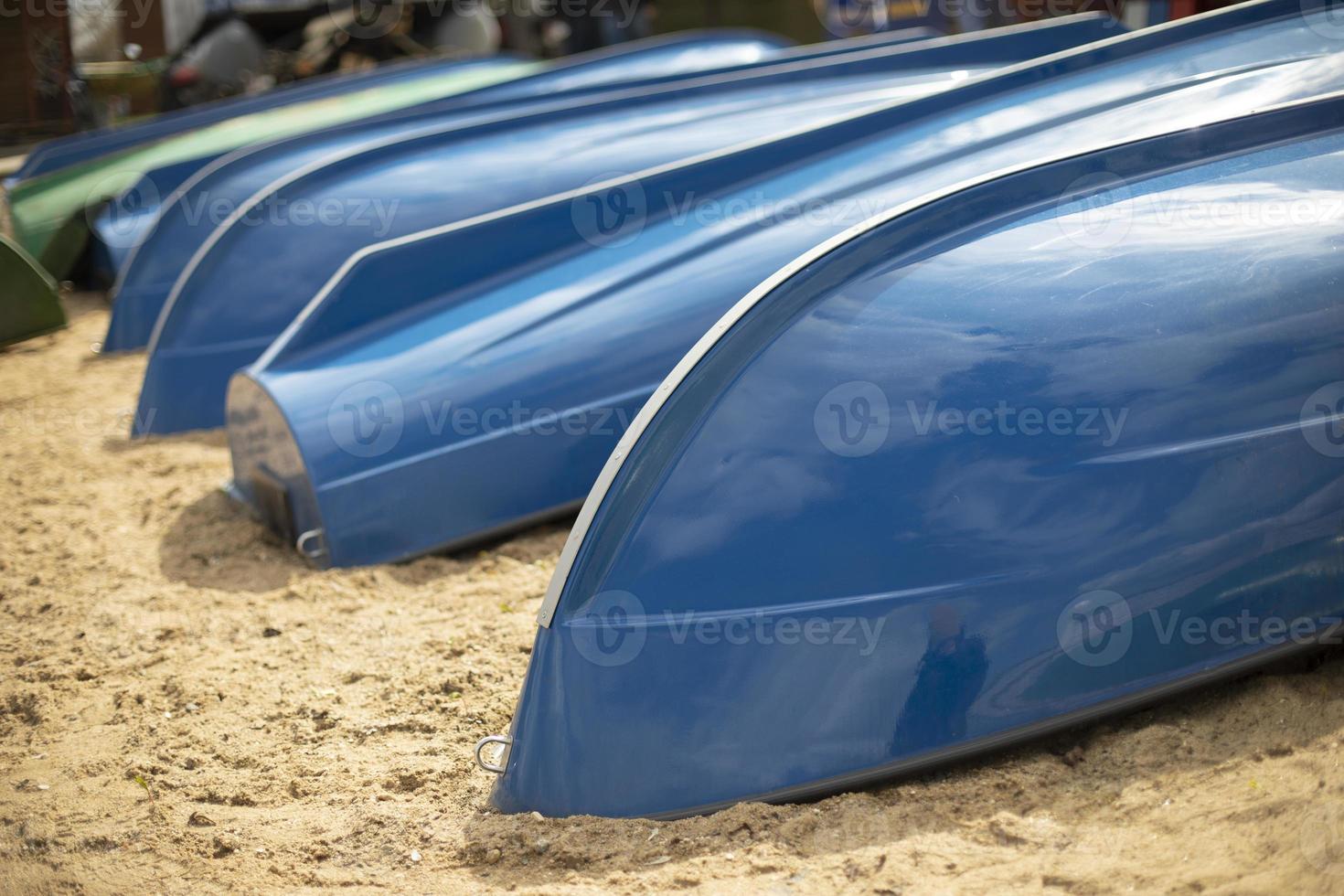 Blue boats on beach. Boat station on lake. photo