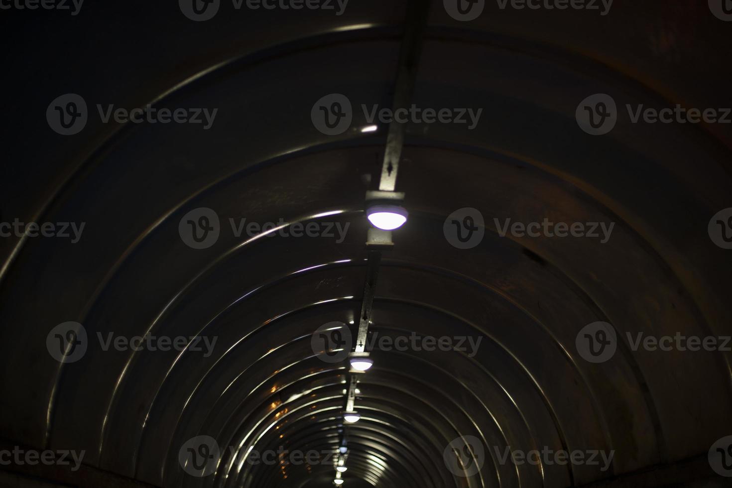 Tunnel at night. Details of architecture in dark. photo