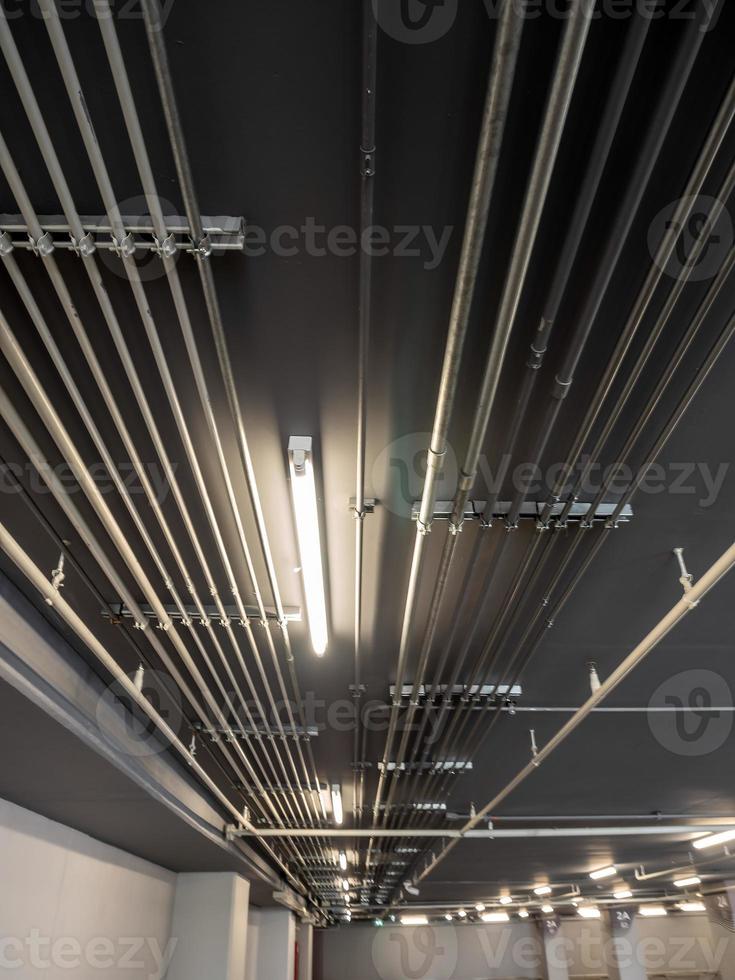 Installation of Electrical metallic conduits on the ceiling photo