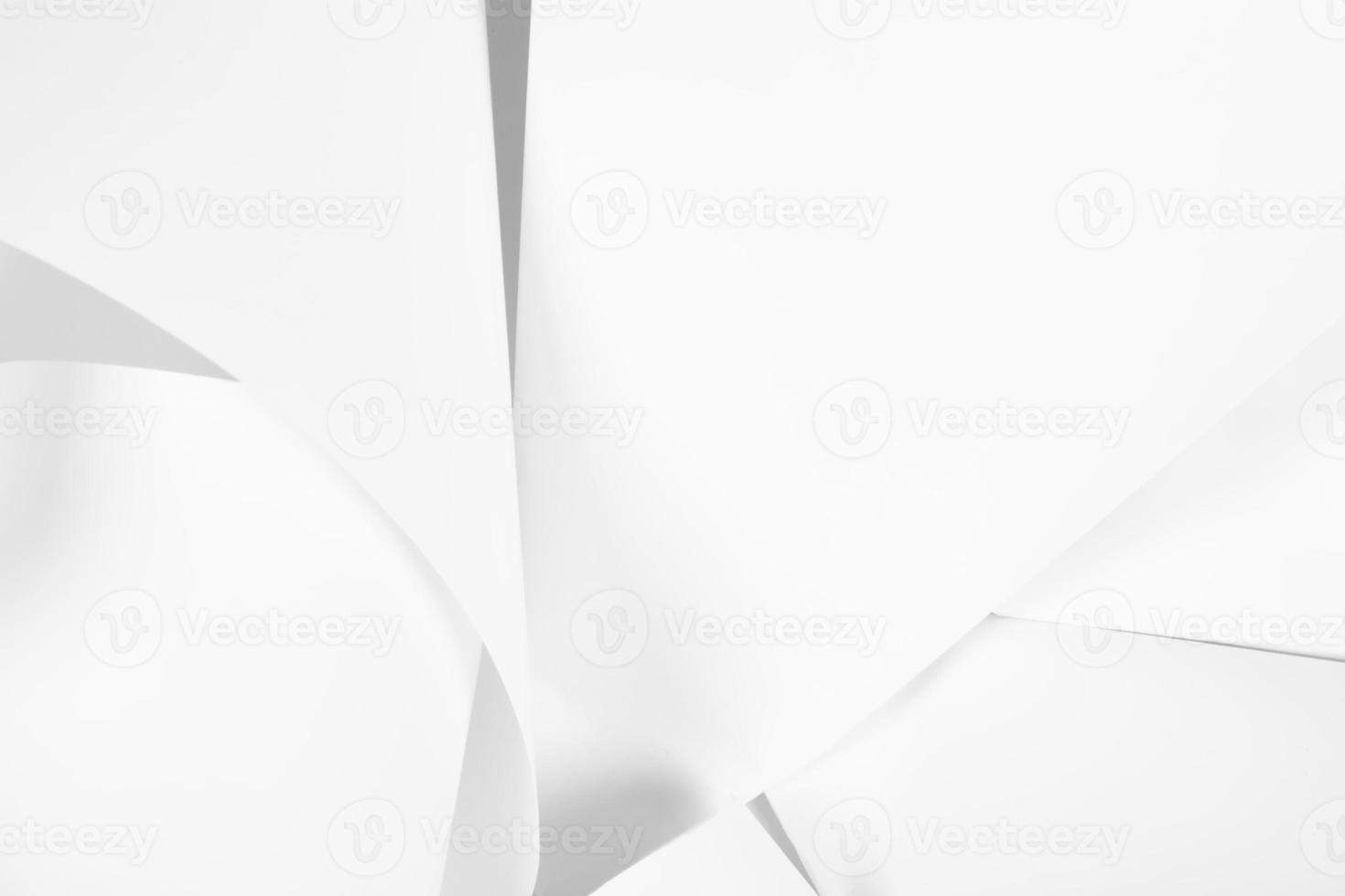 White sheets of office paper are twisted and scattered. Paper white abstract background. photo