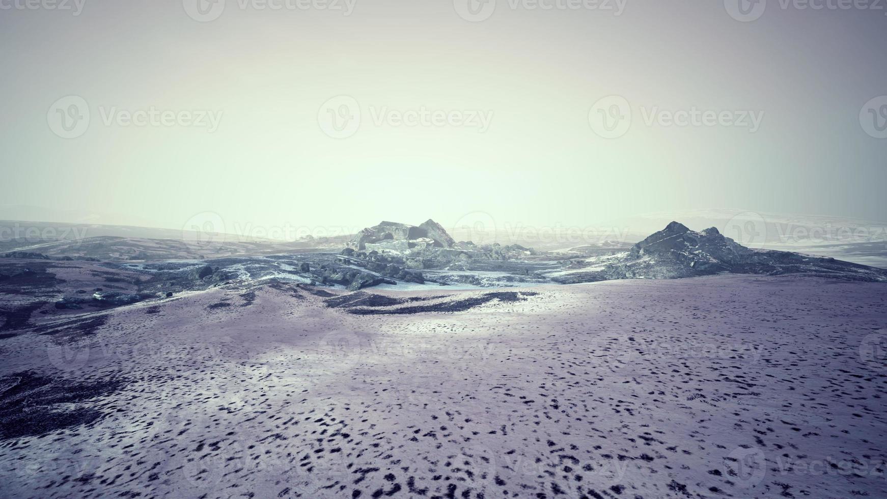 Dramatic winter dark desert steppe on a highland mountain plateau photo