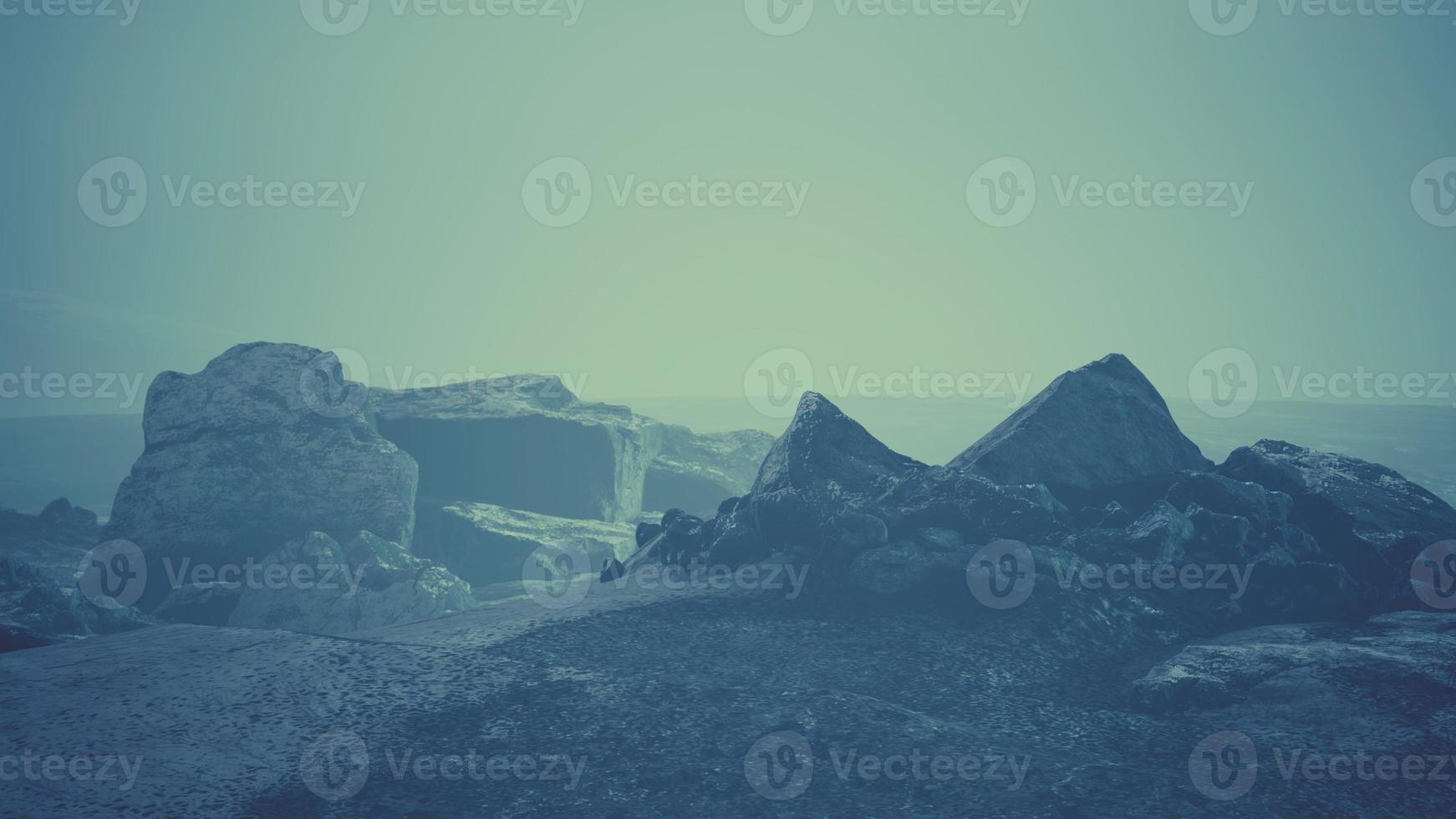 Dramatic winter dark desert steppe on a highland mountain plateau photo