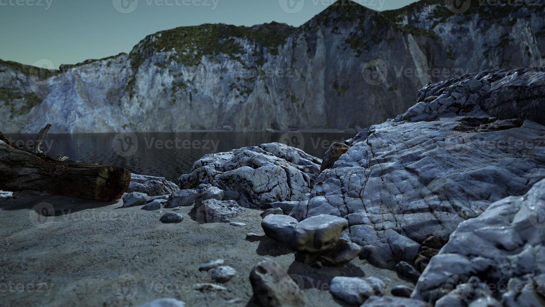 Black sand beach hidden between blurred volcanic rocks photo