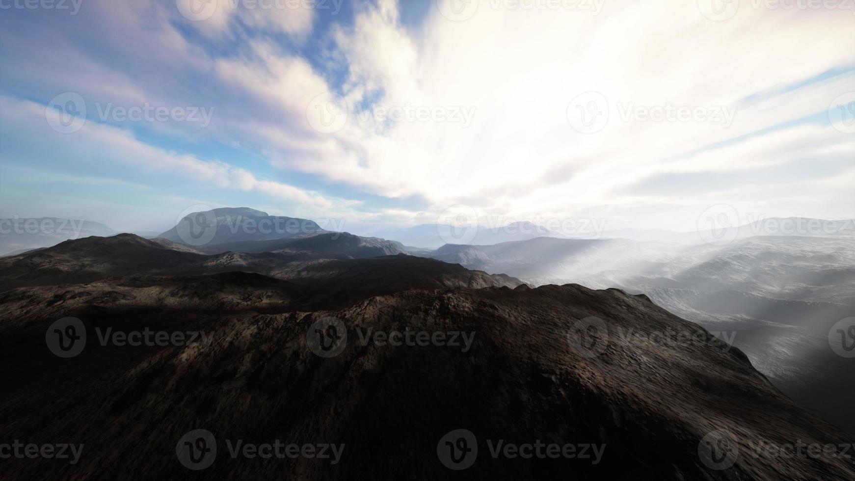 Alpine chains shrouded in the morning fog photo