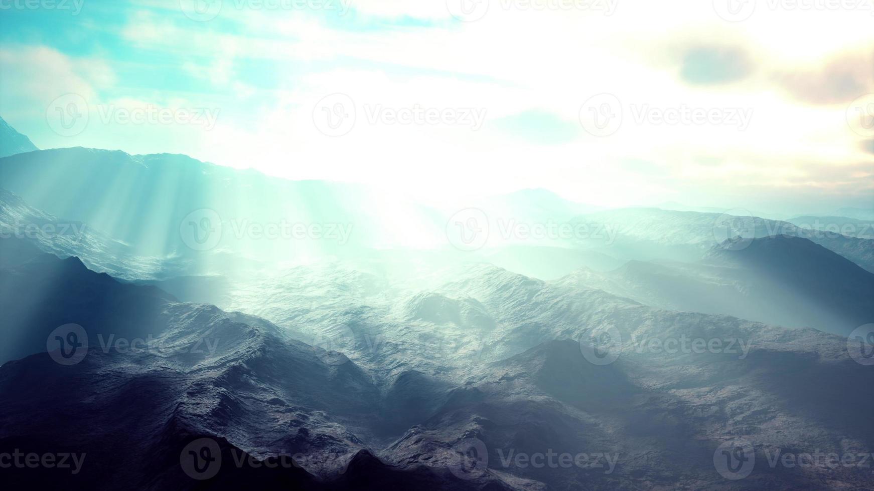 Alpine chains shrouded in the morning fog photo