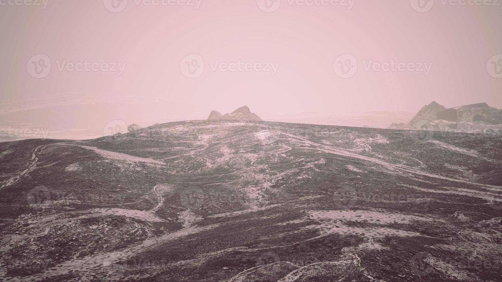 Dramatic winter dark desert steppe on a highland mountain plateau photo