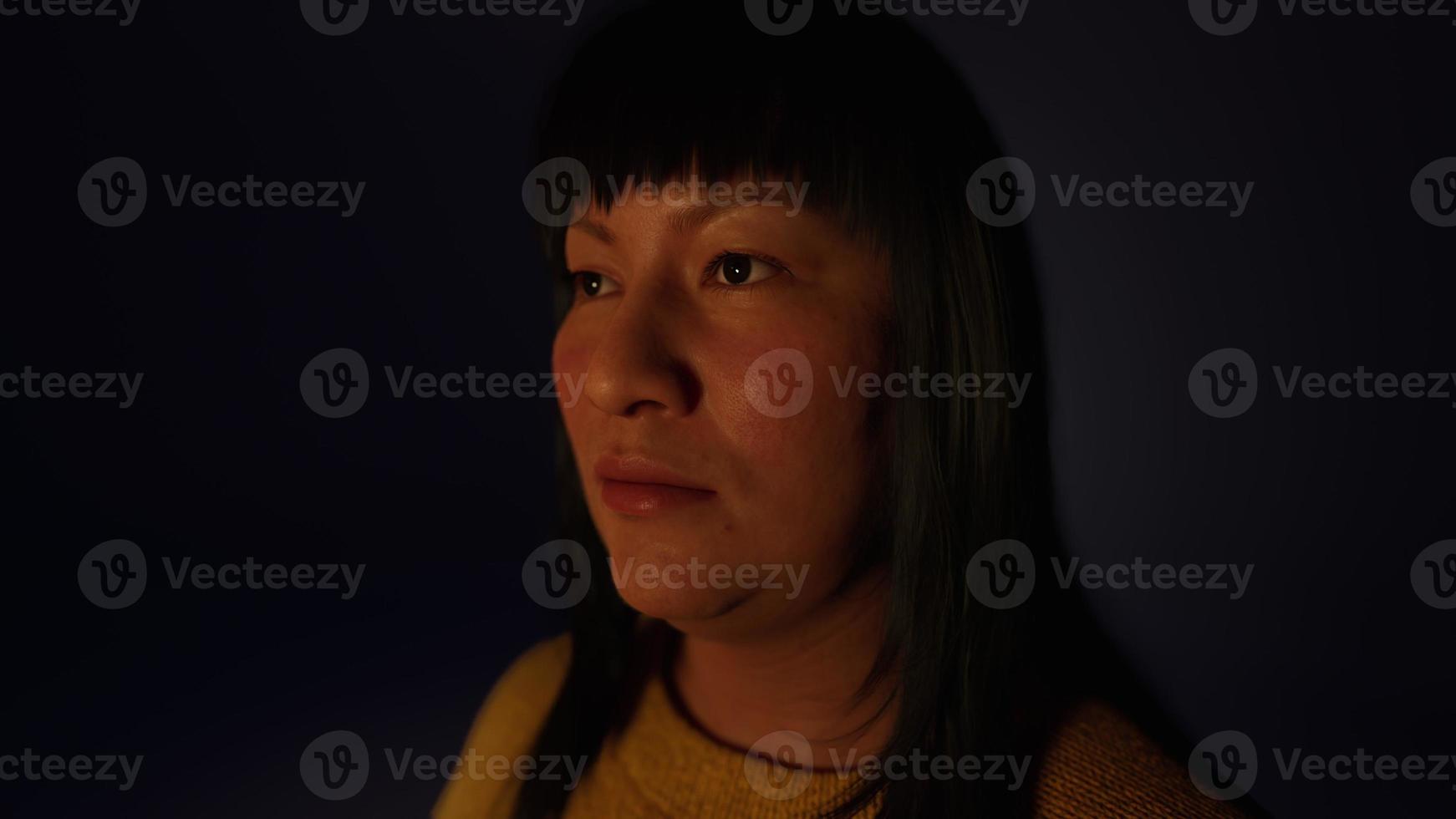 adult Mexican lady portrait in the dark photo