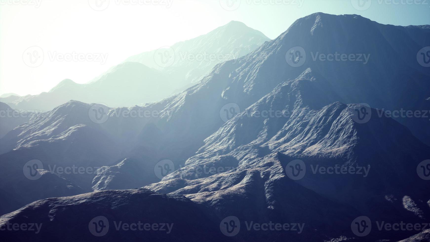 View of the Afghan mountains in fog photo