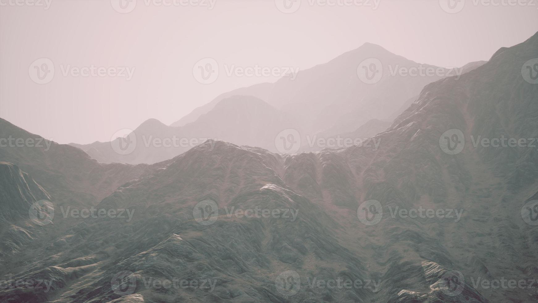 View of the Afghan mountains in fog photo