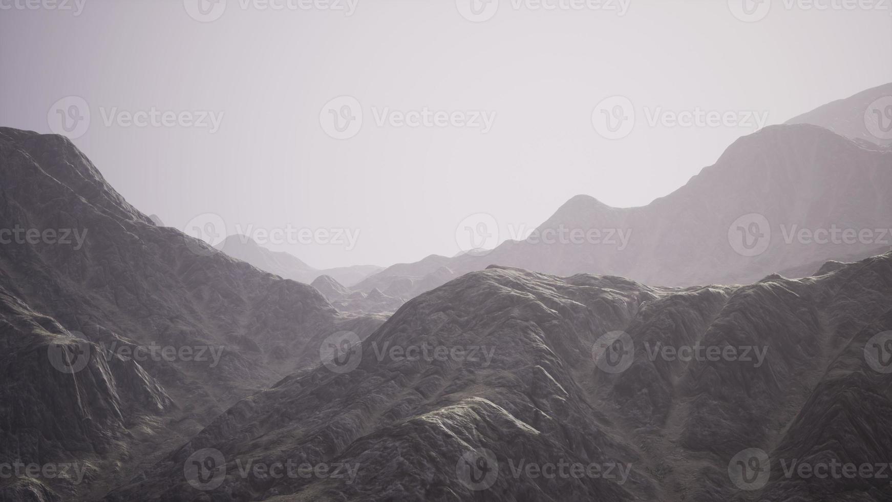 View of the Afghan mountains in fog photo