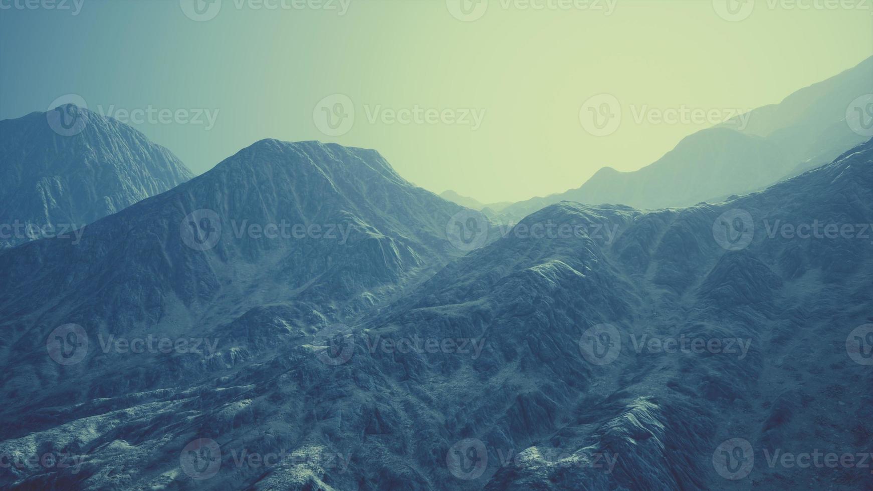 View of the Afghan mountains in fog photo