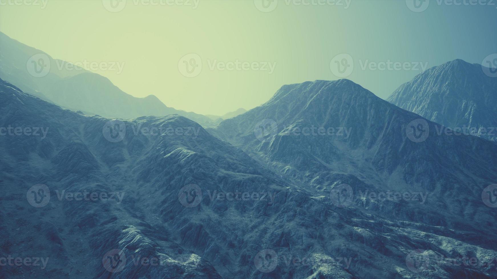 View of the Afghan mountains in fog photo