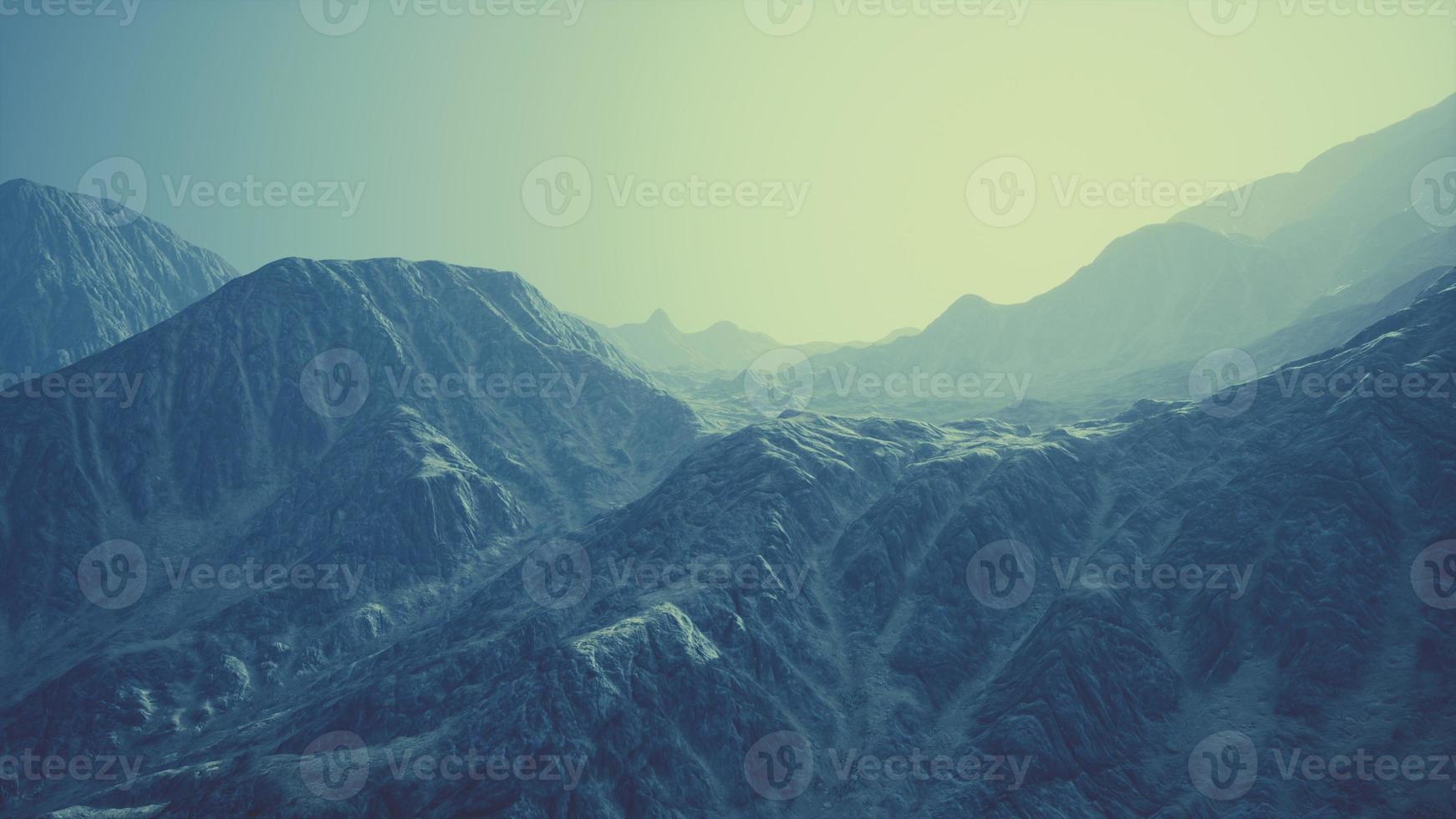 View of the Afghan mountains in fog photo