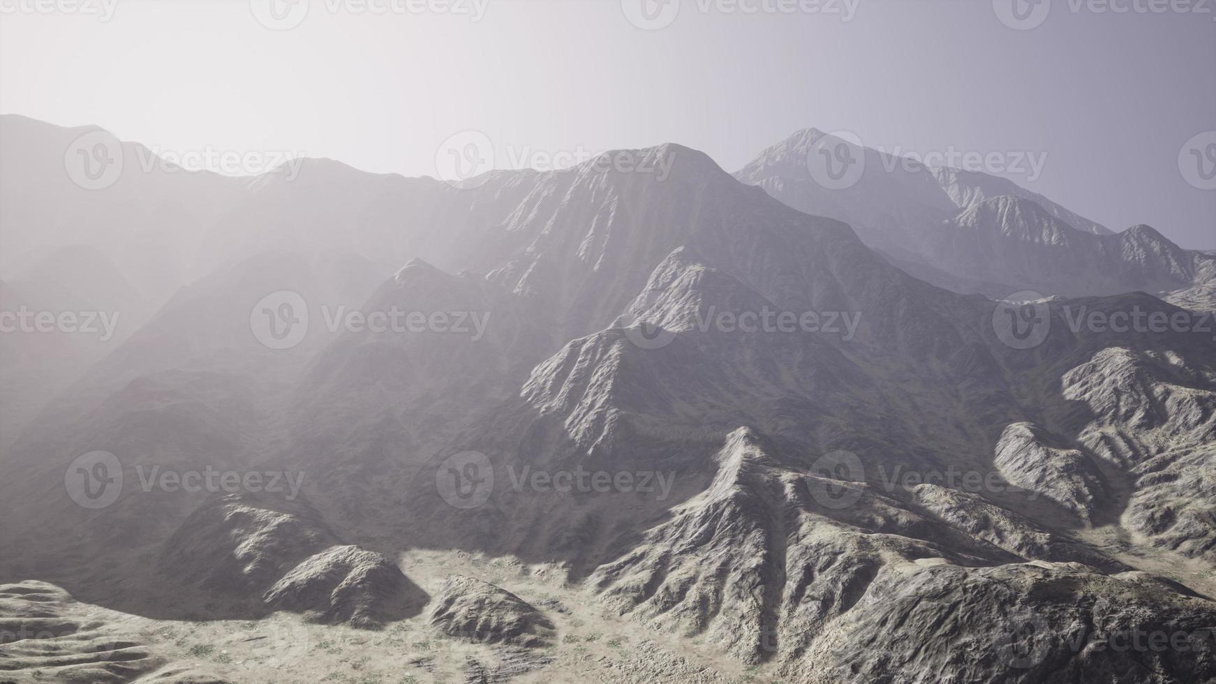 View of the Afghan mountains in fog photo