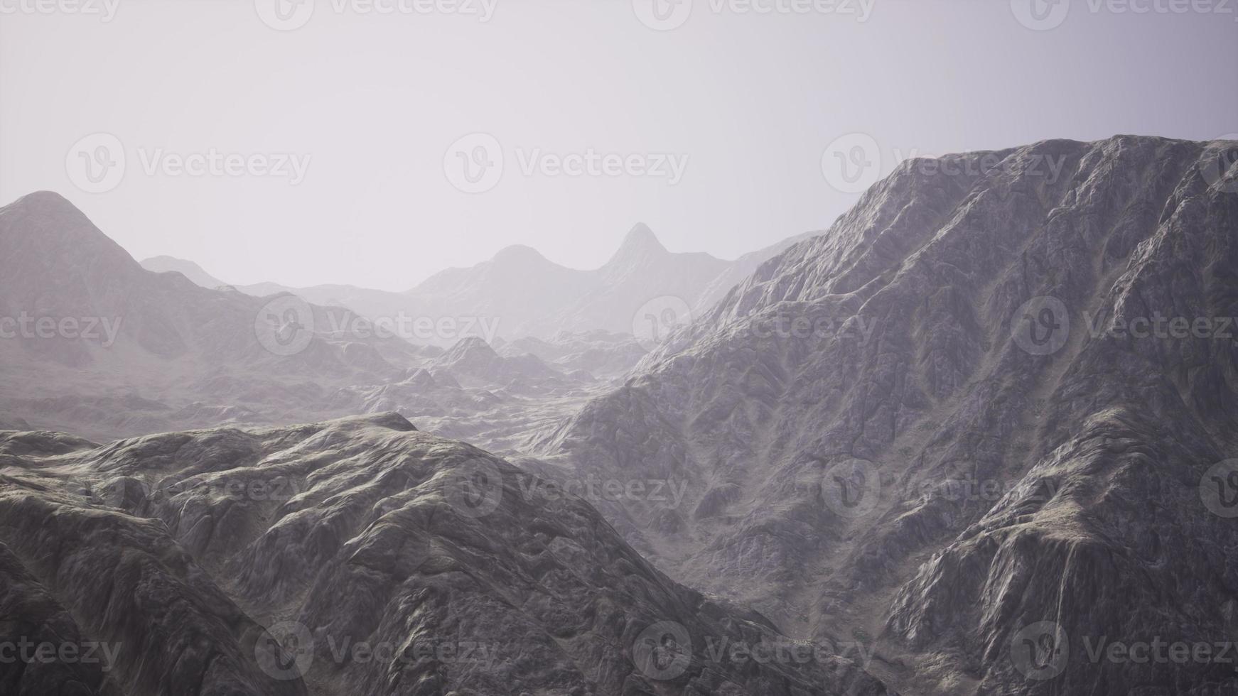 View of the Afghan mountains in fog photo