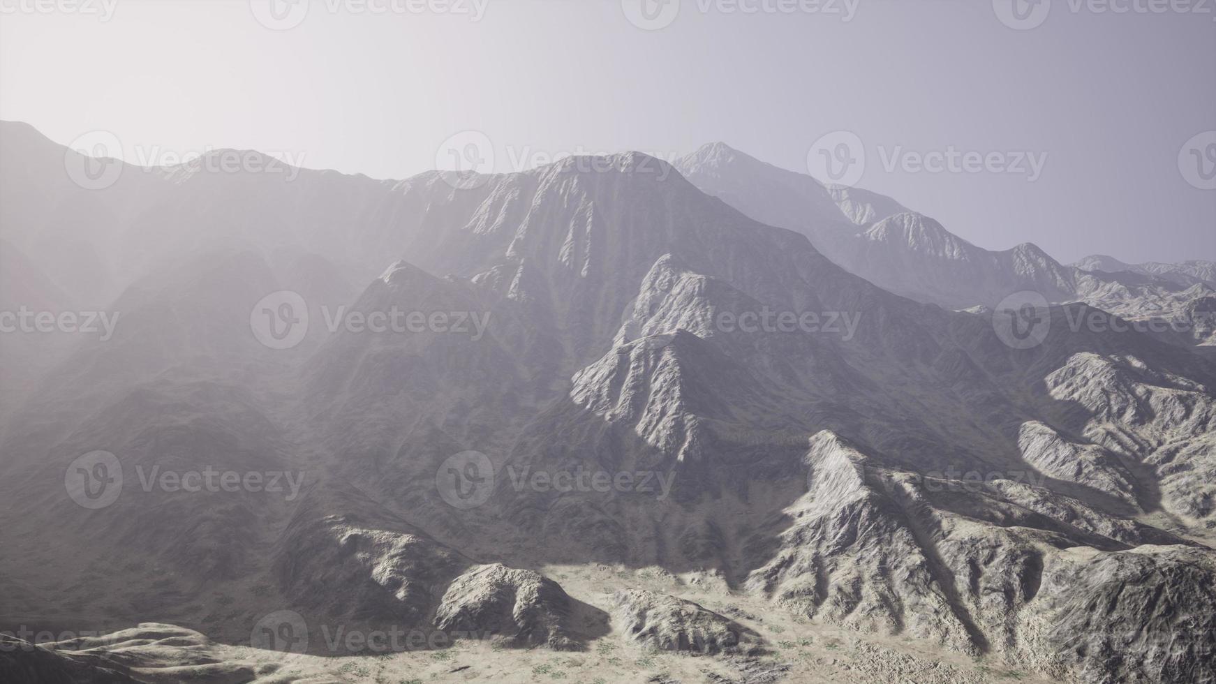 View of the Afghan mountains in fog photo