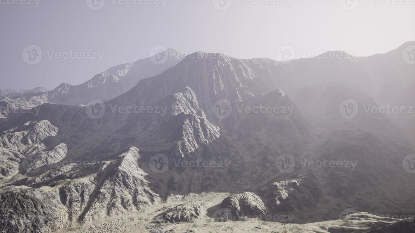 View of the Afghan mountains in fog photo