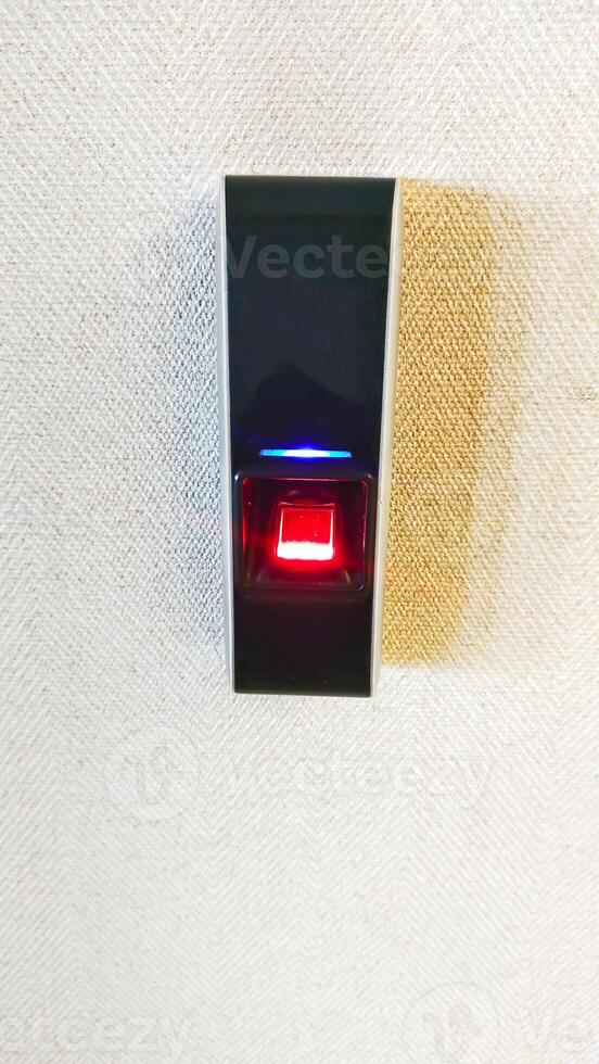 Access control biometric finger scanner security system to open the door. photo