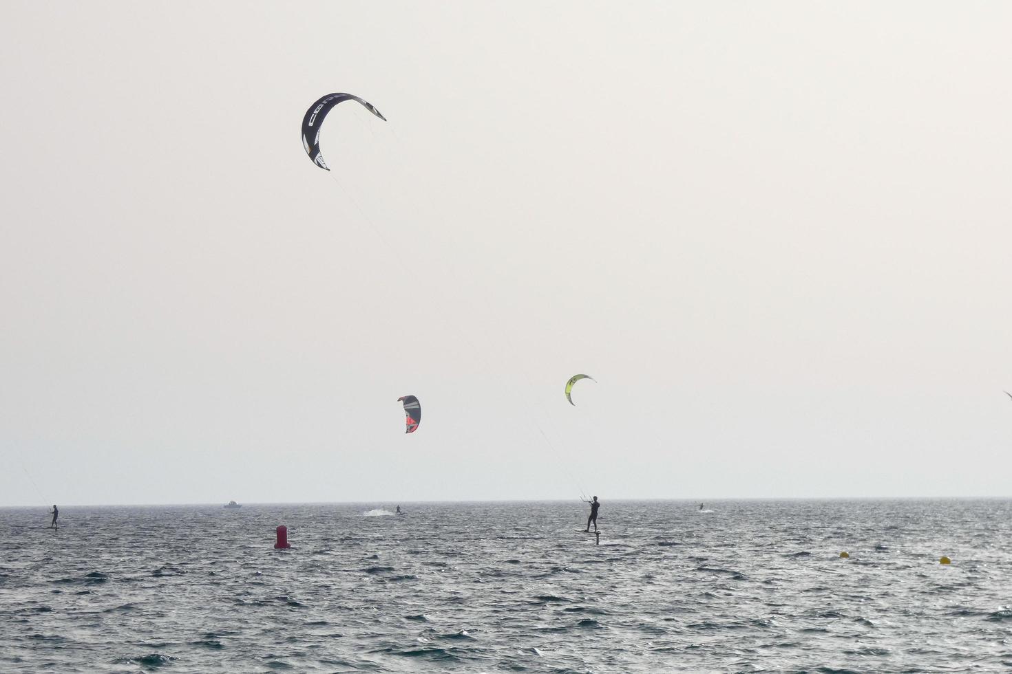 windsurfing, kitesurfing, water and wind sports powered by sails or kites photo