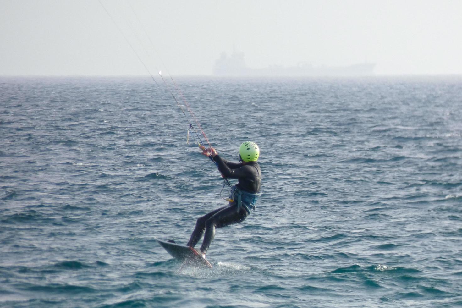 windsurfing, kitesurfing, water and wind sports powered by sails or kites photo