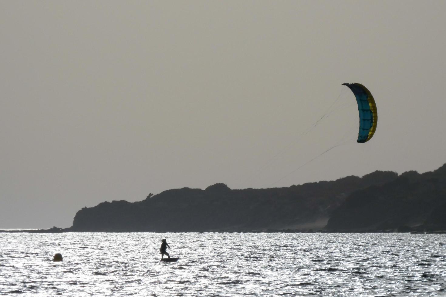 windsurfing, kitesurfing, water and wind sports powered by sails or kites photo