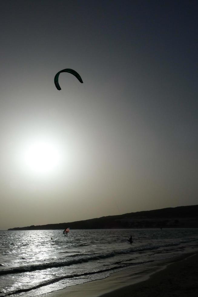 windsurfing, kitesurfing, water and wind sports powered by sails or kites photo