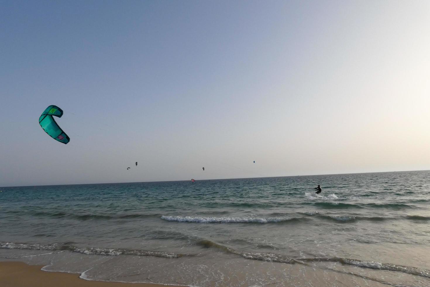 windsurfing, kitesurfing, water and wind sports powered by sails or kites photo