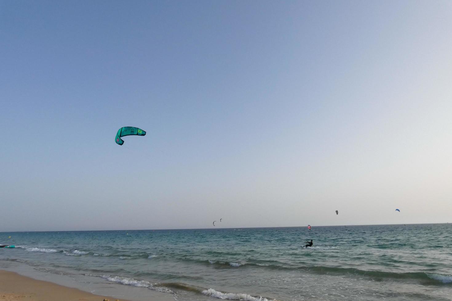 windsurfing, kitesurfing, water and wind sports powered by sails or kites photo