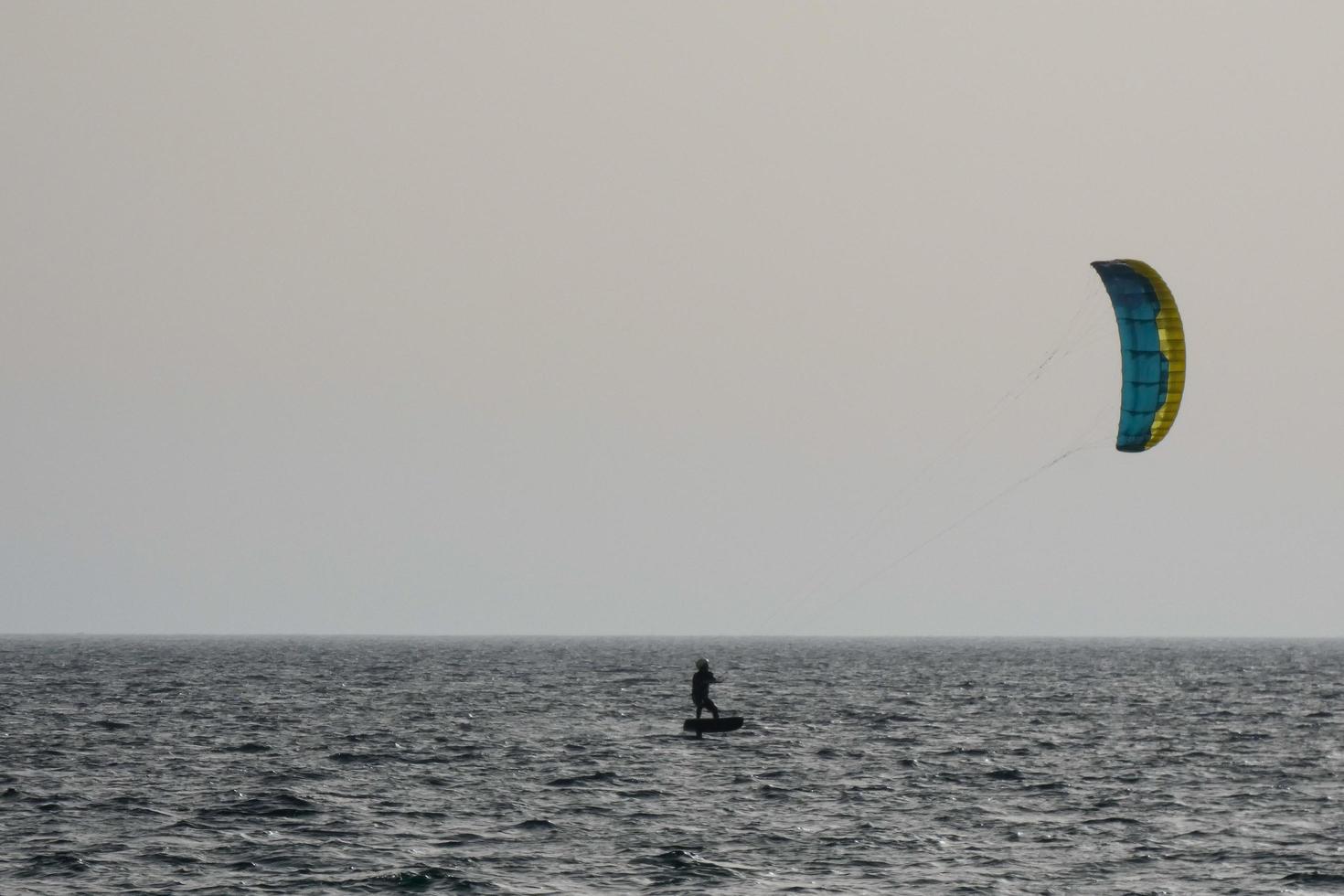 windsurfing, kitesurfing, water and wind sports powered by sails or kites photo