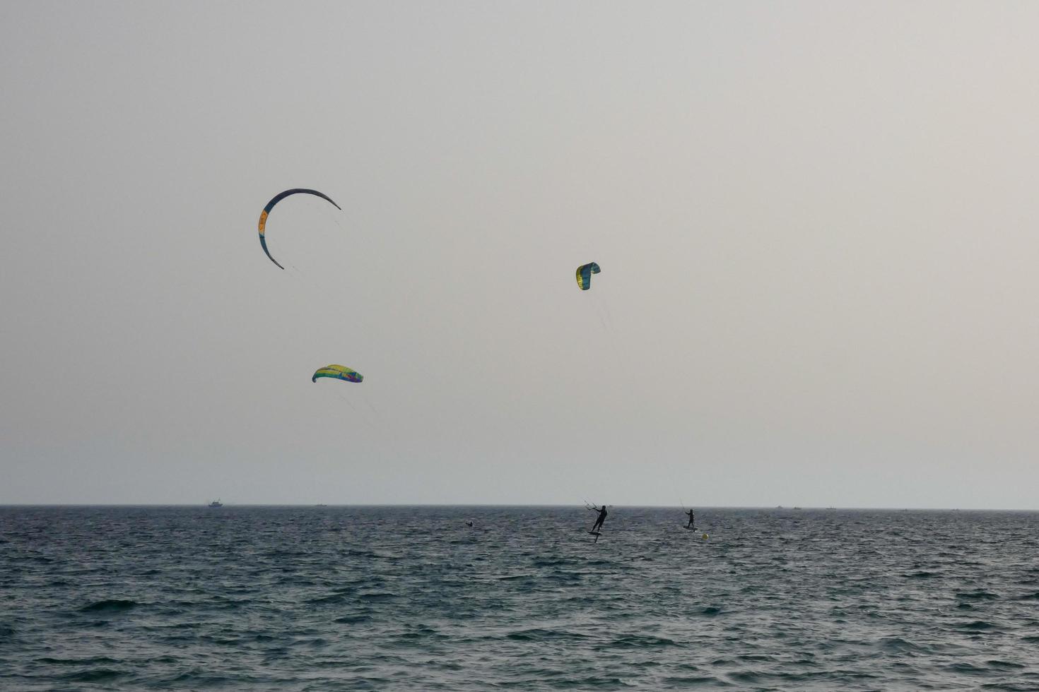 windsurfing, kitesurfing, water and wind sports powered by sails or kites photo