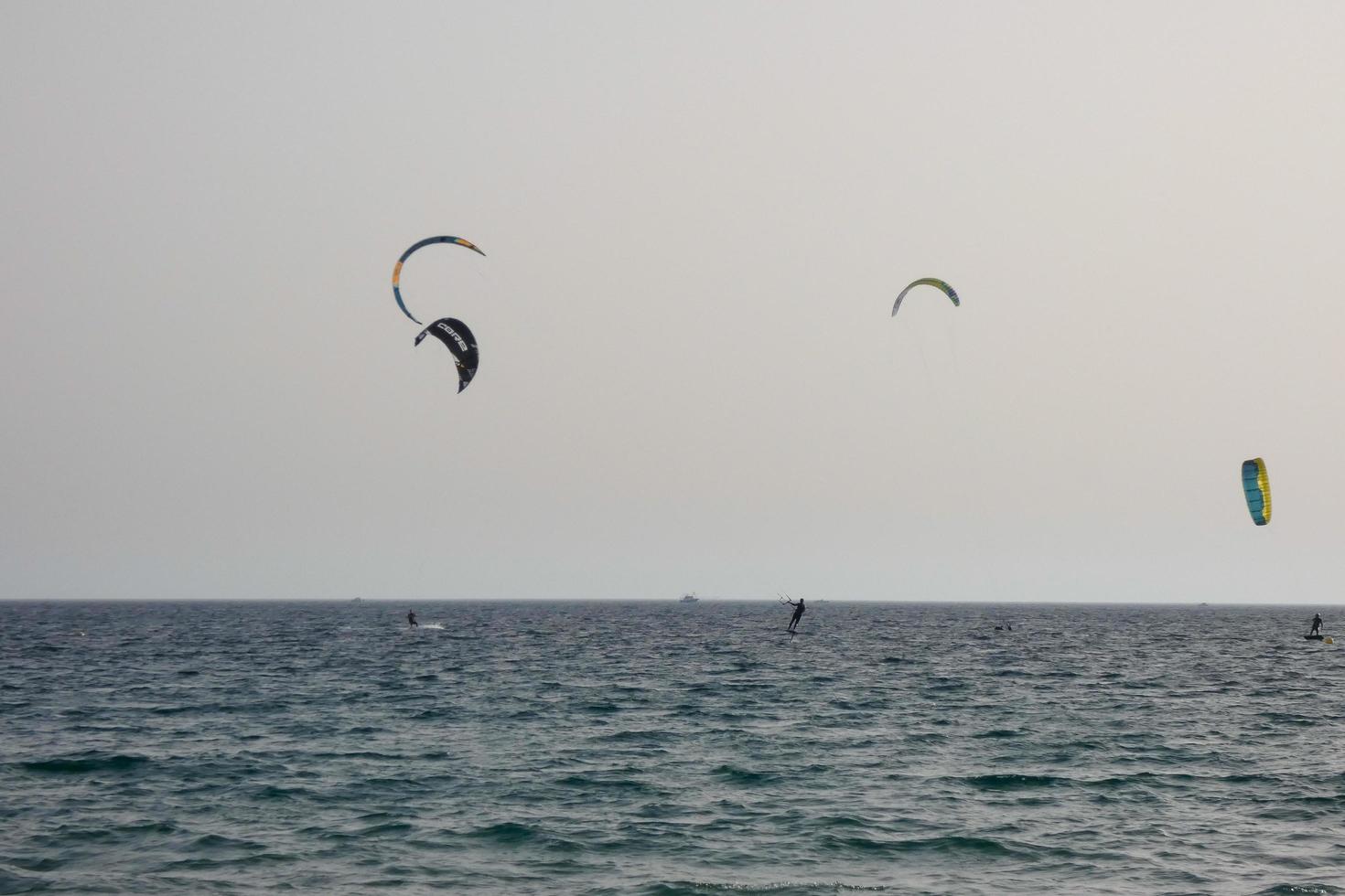 windsurfing, kitesurfing, water and wind sports powered by sails or kites photo