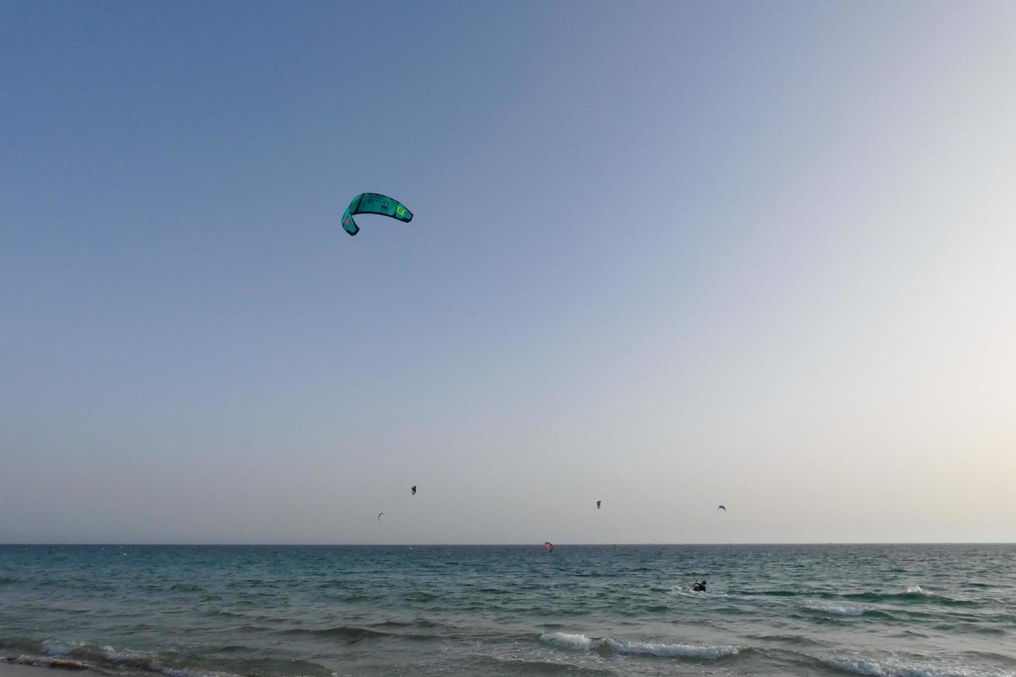 windsurfing, kitesurfing, water and wind sports powered by sails or kites photo