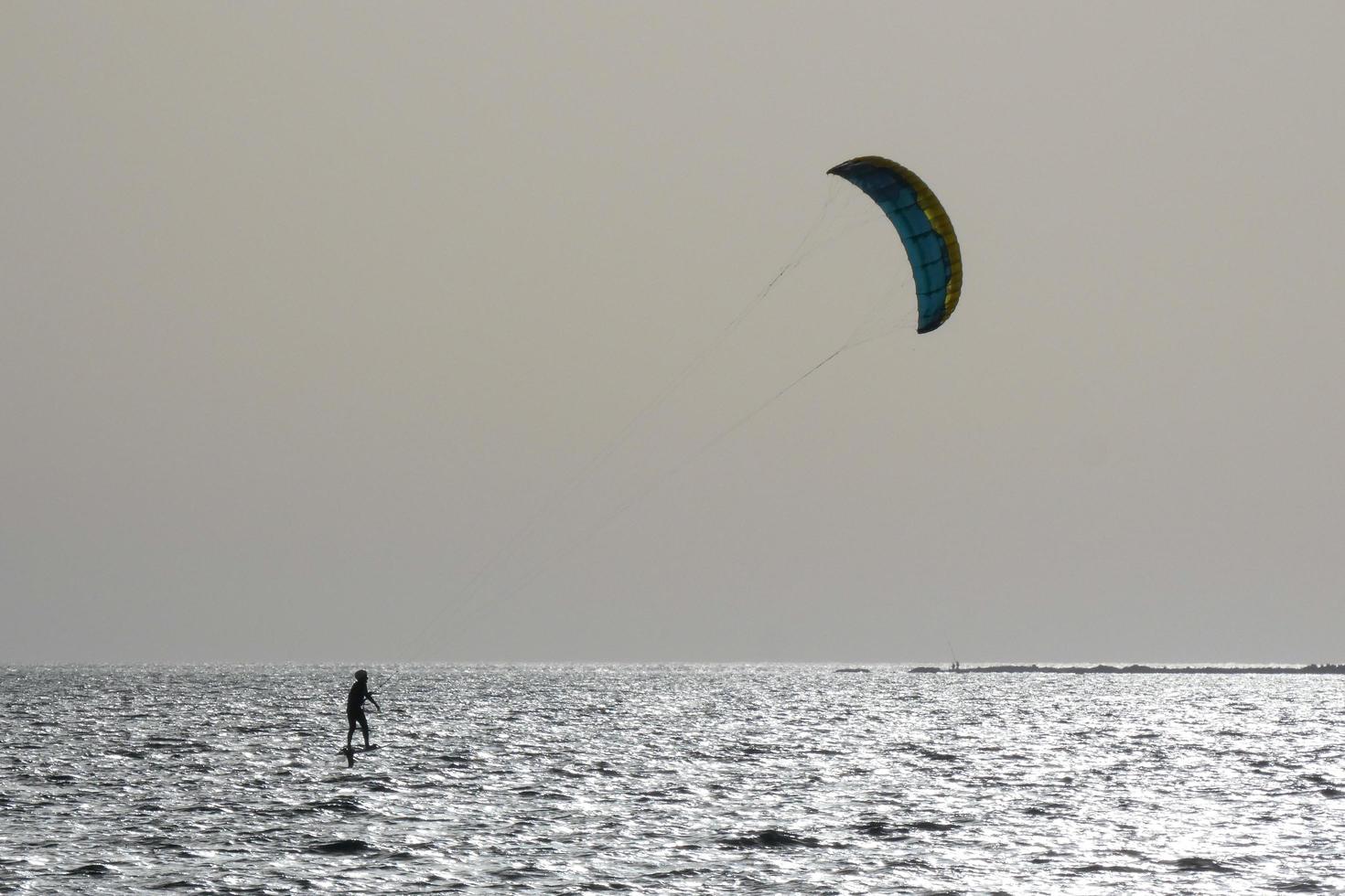 windsurfing, kitesurfing, water and wind sports powered by sails or kites photo