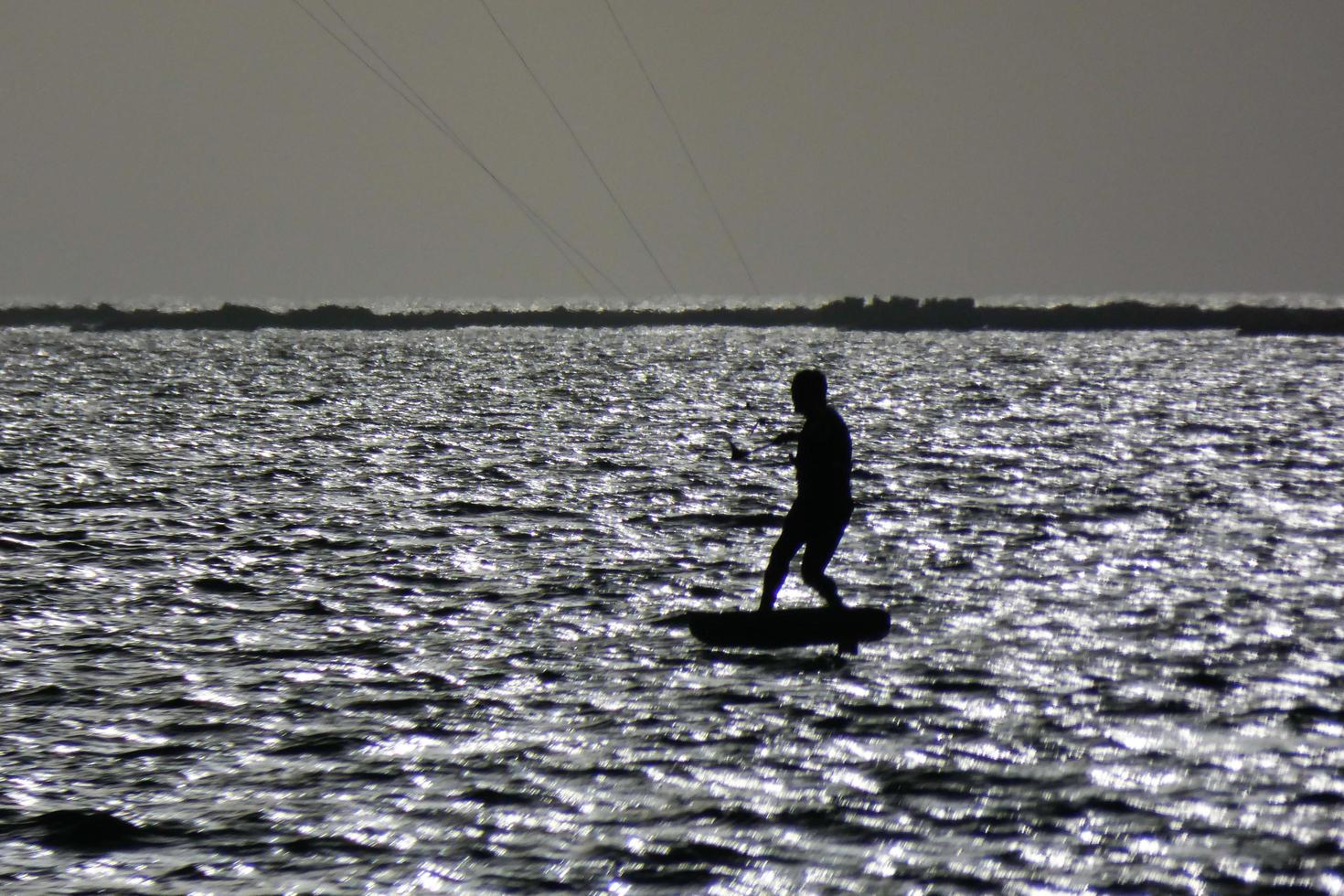 windsurfing, kitesurfing, water and wind sports powered by sails or kites photo