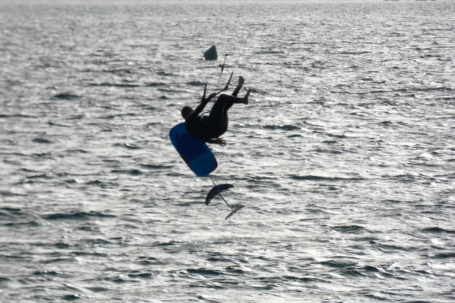 windsurfing, kitesurfing, water and wind sports powered by sails or kites photo