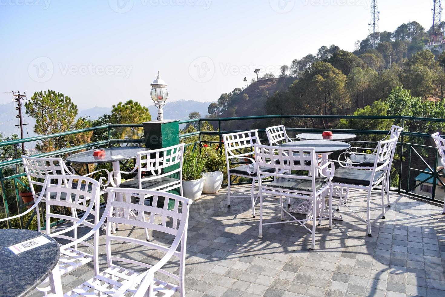 Early morning view of Modern rooftop restaurant at Kasauli, Himachal Pradesh in India, View of mountain hills from open air restaurant in Kasauli, Kasauli Rooftop restaurant photo