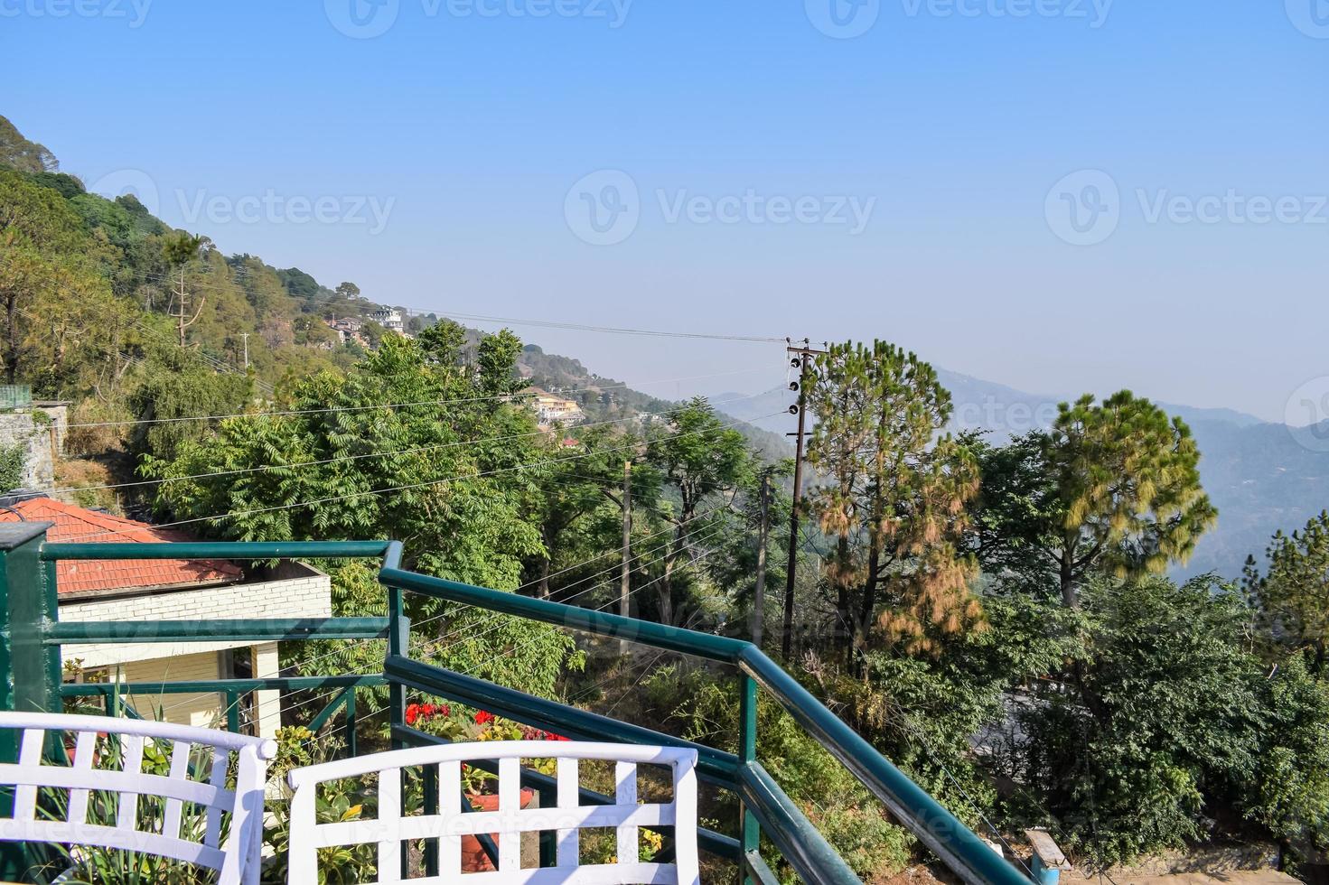 Early morning view of Modern rooftop restaurant at Kasauli, Himachal Pradesh in India, View of mountain hills from open air restaurant in Kasauli, Kasauli Rooftop restaurant photo