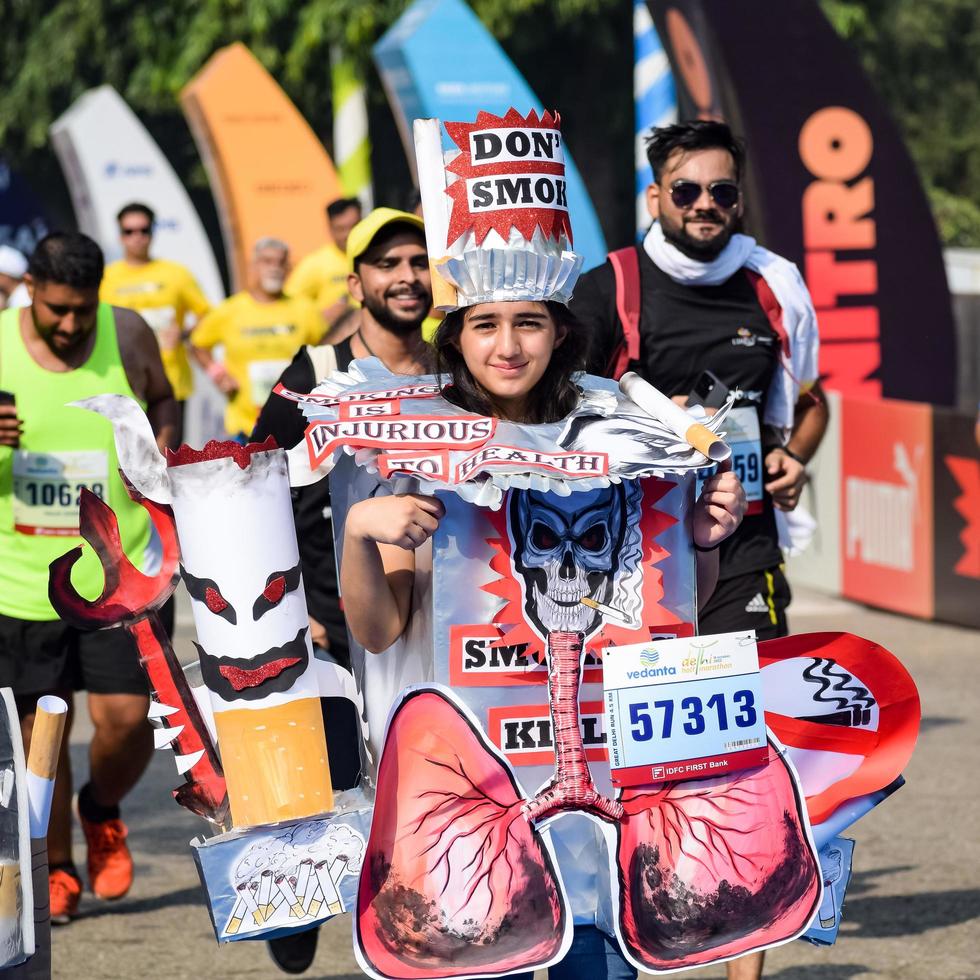 New Delhi, India - October 16 2022 - Vedanta Delhi Half Marathon race after covid in which marathon participants about to cross the finish line, Delhi Half Marathon 2022 photo