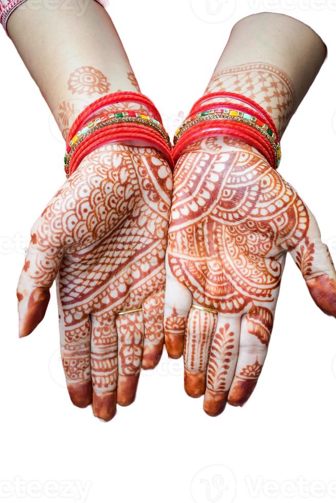 Beautiful woman dressed up as Indian tradition with henna mehndi design on her both hands to celebrate big festival of Karwa Chauth with plain white background photo