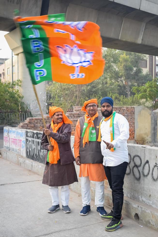 Delhi, India, December 02 2022 - Bharatiya Janata Party BJP supporter during mega road show in support of BJP candidate Pankaj Luthara to file nomination papers ahead of MCD local body Elections 2022 photo