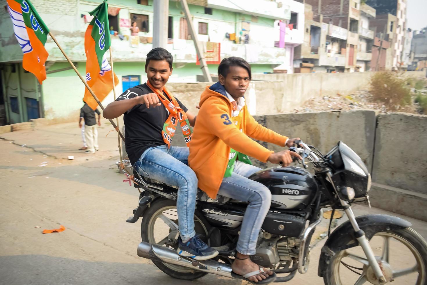 Delhi, India, December 02 2022 - Bharatiya Janata Party BJP supporter during mega road show in support of BJP candidate Pankaj Luthara to file nomination papers ahead of MCD local body Elections 2022 photo