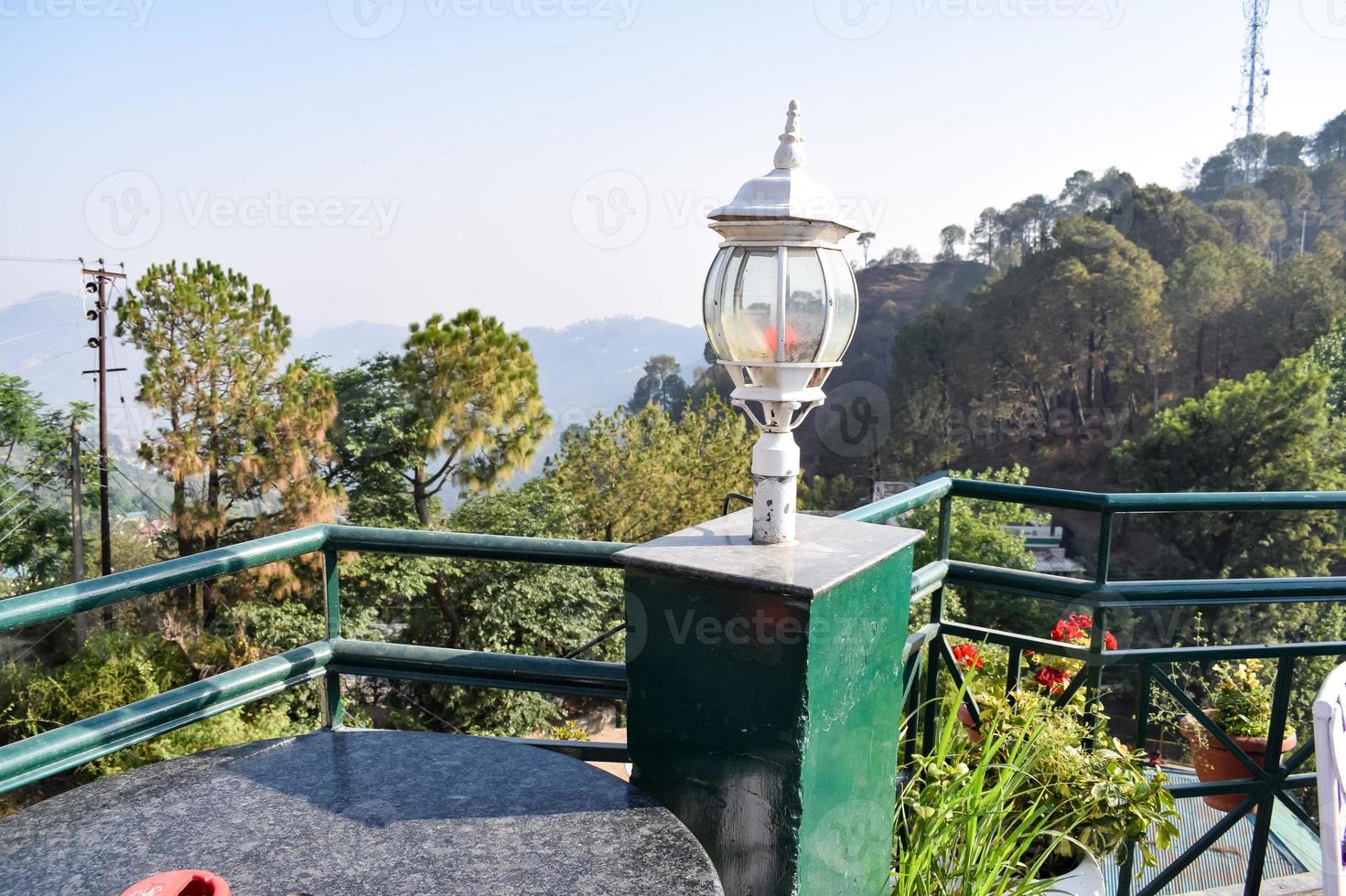 Early morning view of Modern rooftop restaurant at Kasauli, Himachal Pradesh in India, View of mountain hills from open air restaurant in Kasauli, Kasauli Rooftop restaurant photo