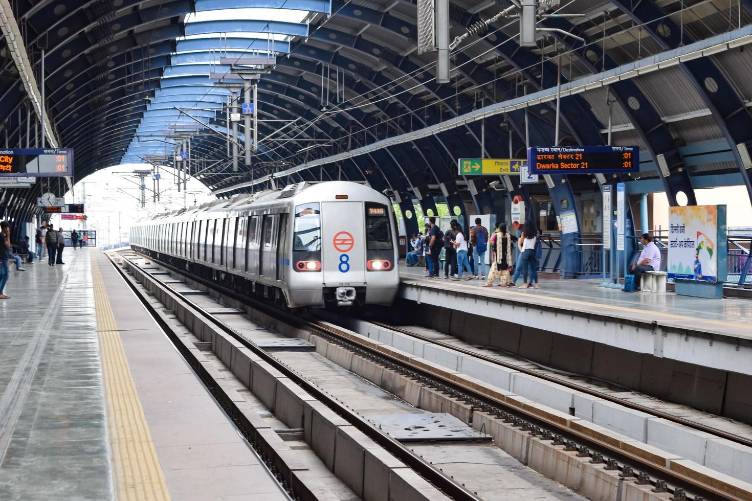 New Delhi India - June 21 2022 - Delhi Metro train arriving at Jhandewalan metro station in New Delhi, India, Asia, Public Metro departing from Jhandewalan station photo