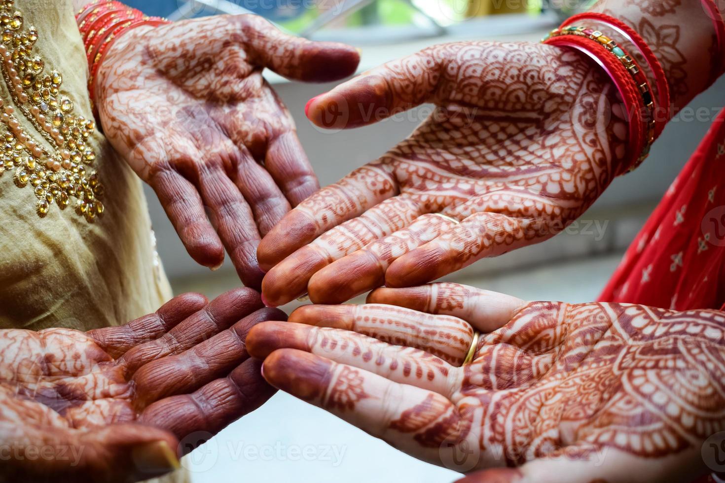 Beautiful woman dressed up as Indian tradition with henna mehndi design on her both hands to celebrate big festival of Karwa Chauth, Karwa Chauth celebrations by Indian woman for her husband photo