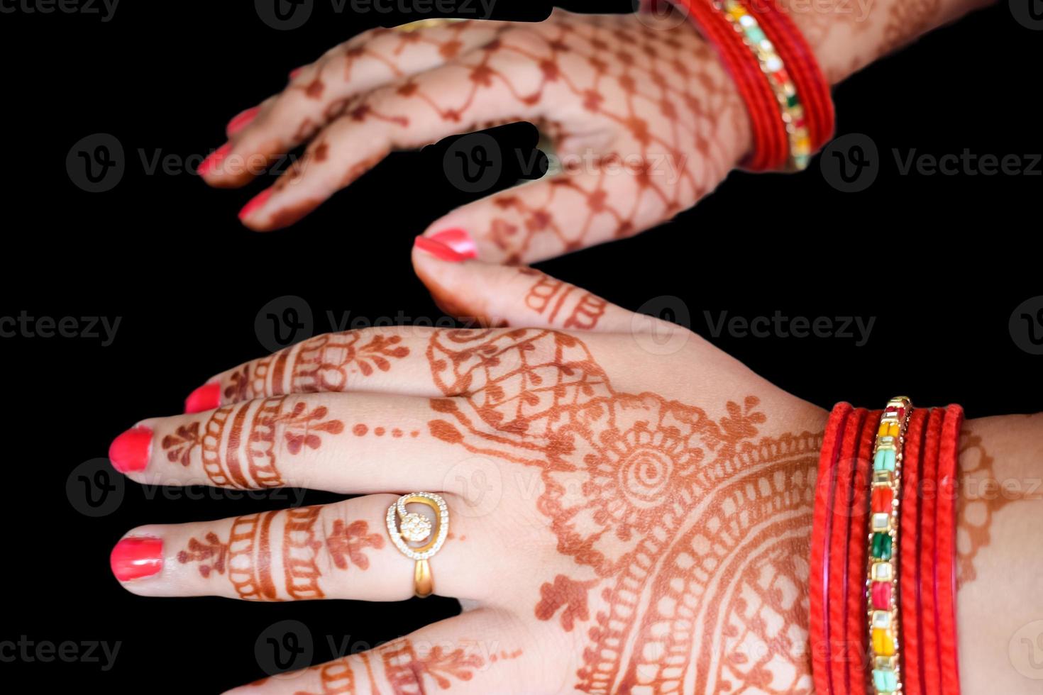 Beautiful woman dressed up as Indian tradition with henna mehndi design on her both hands to celebrate big festival of Karwa Chauth with plain white background photo